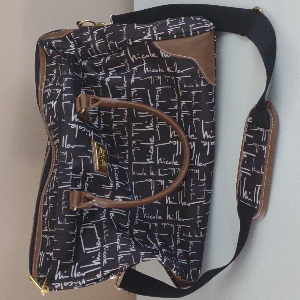 Nicole Miller overnight/gym bag Black and white with leopard lining! Beautiful!